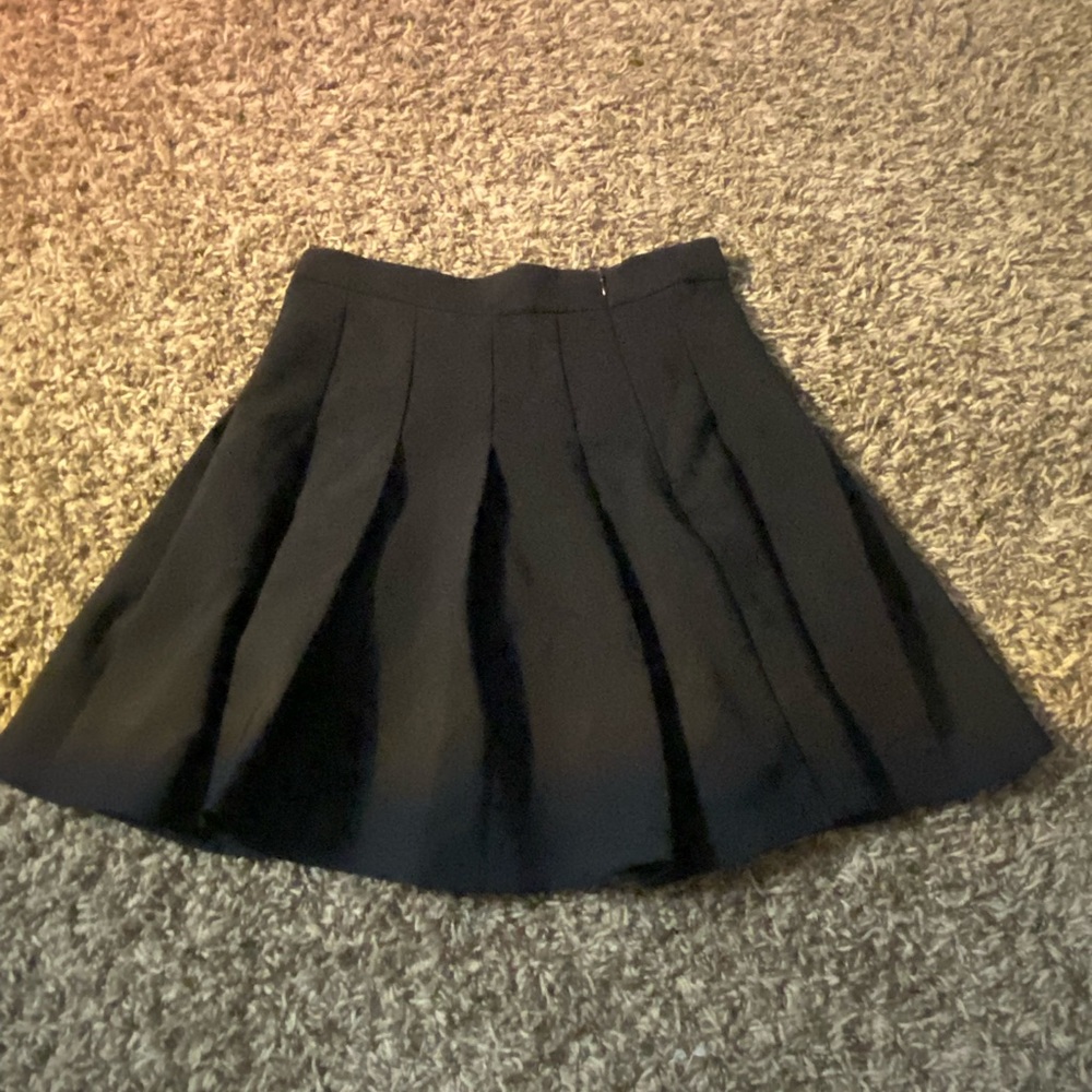 Pleated black skirt, never worn.